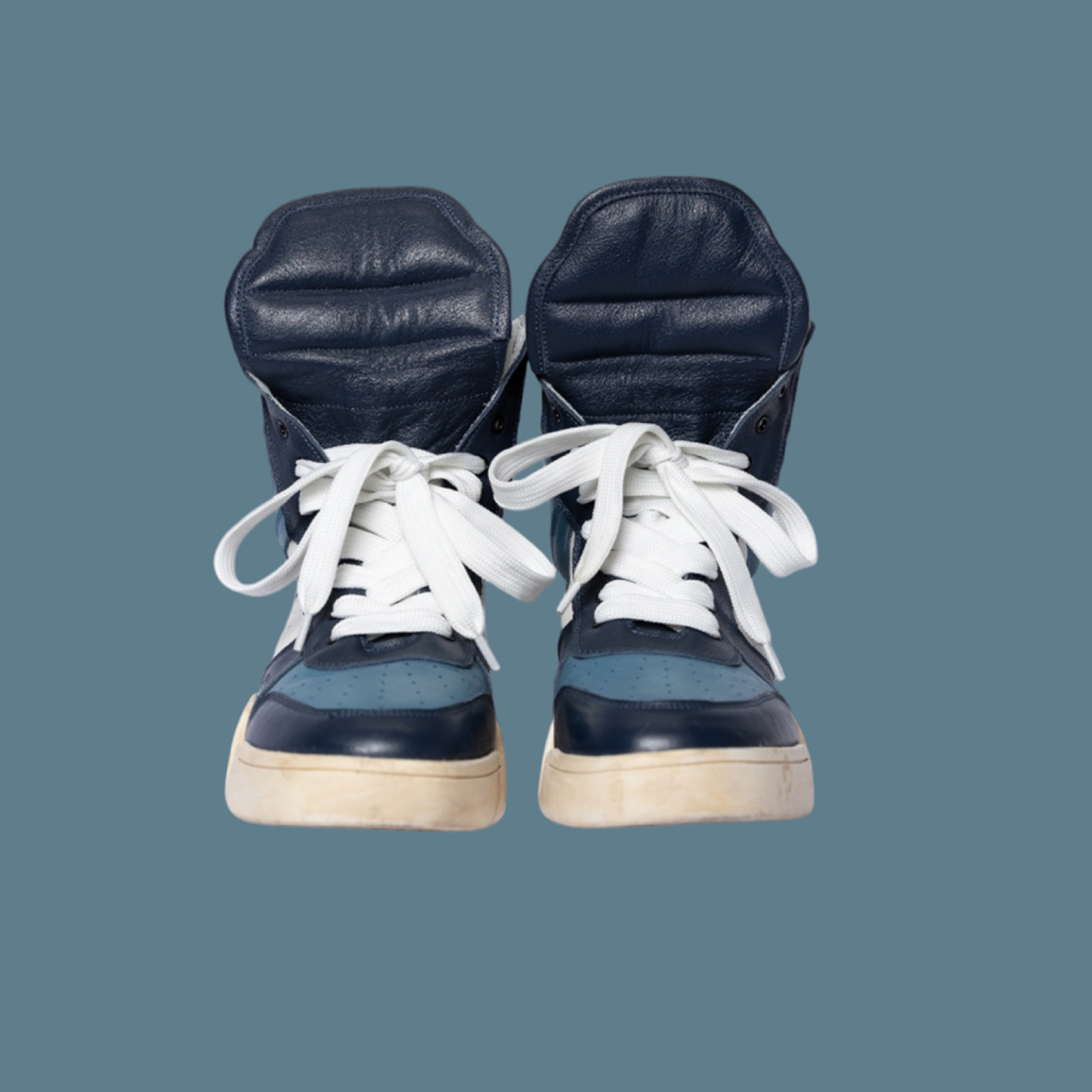 Azure navy blue high-top leather sneaker by Chaun Collins — front view